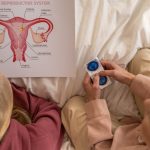 A mother and daughter learning about female reproductive health and contraception.